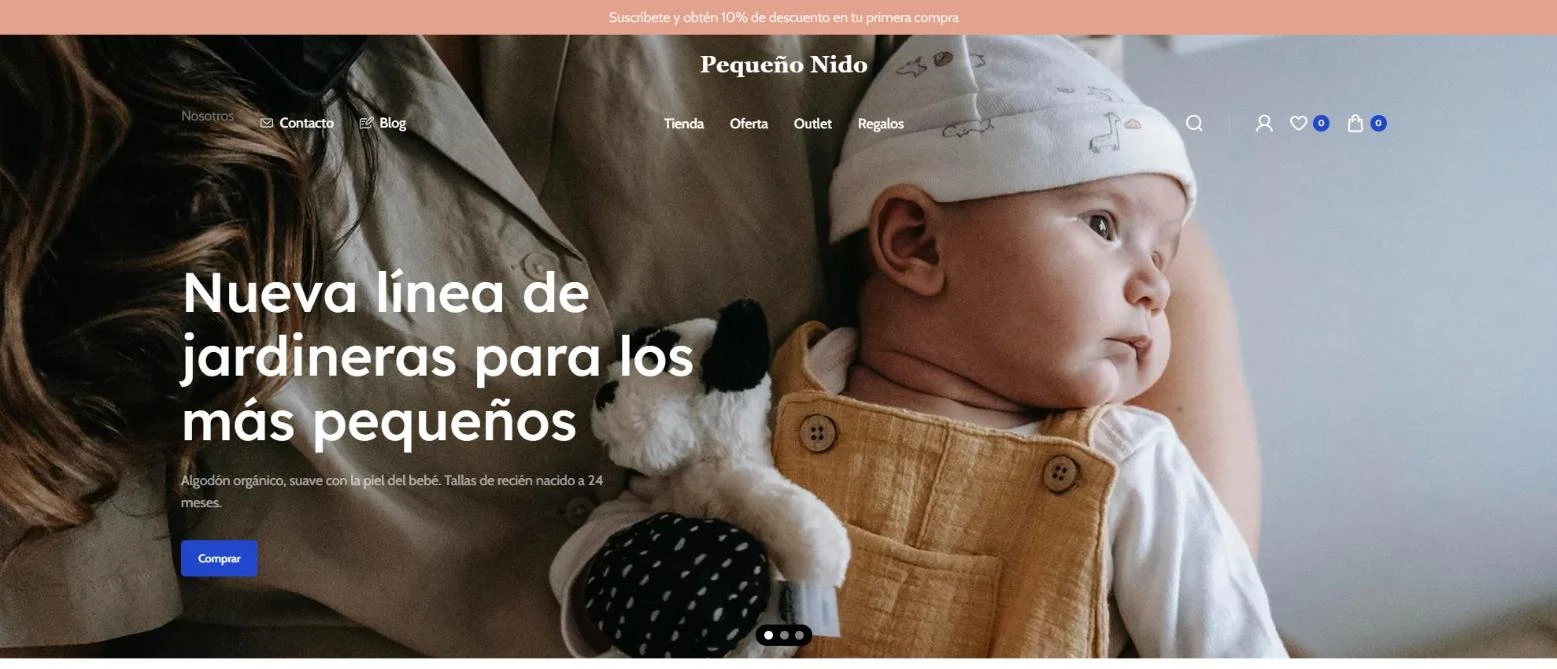 Home de una tienda online de ropa y artículos para bebés en computador con banner de nueva colección